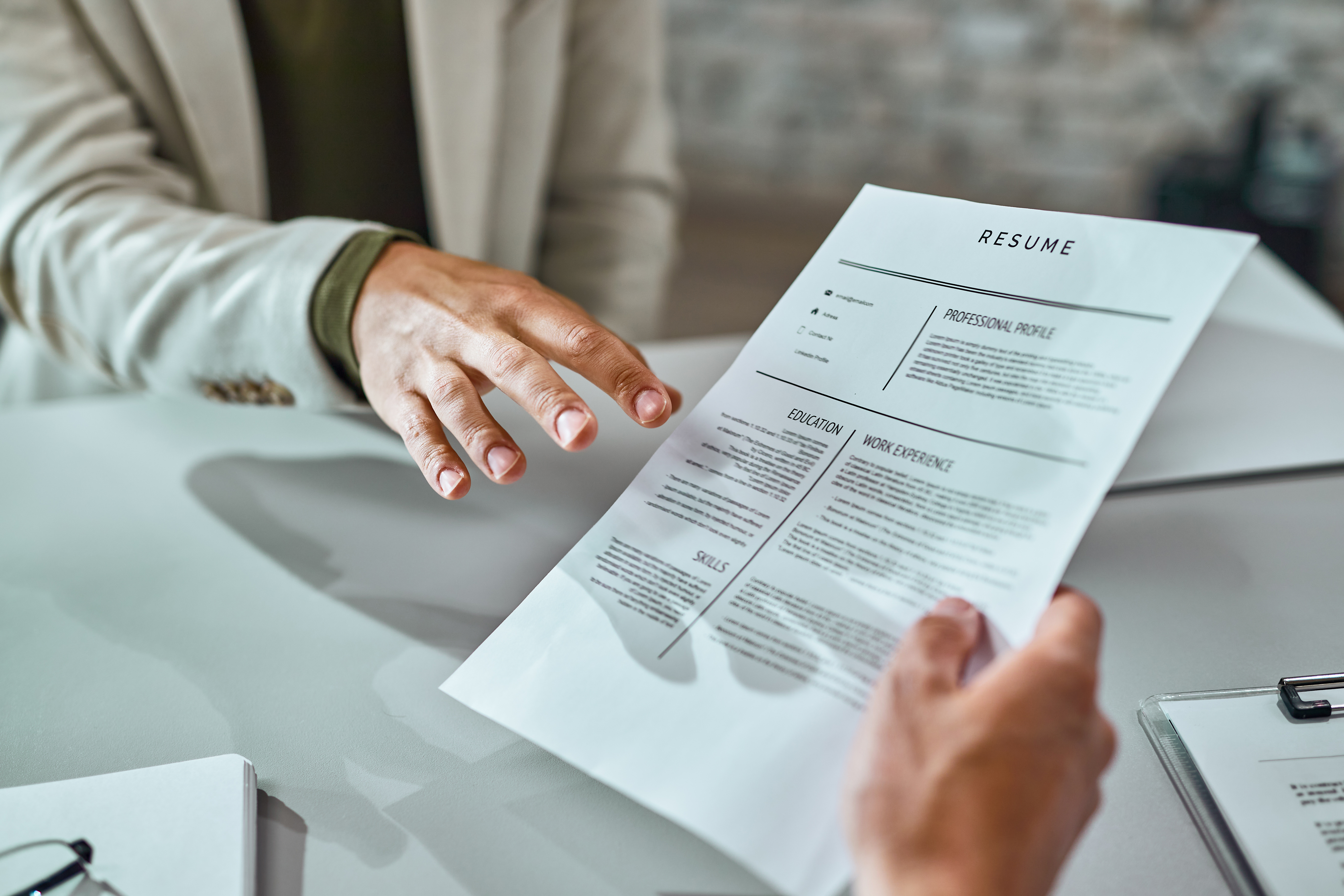 Hands reviewing a resume